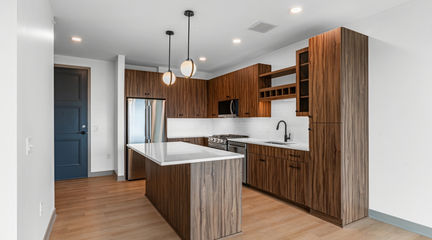 Kitchen with wood cabinets, island, and stainless steel appliances
