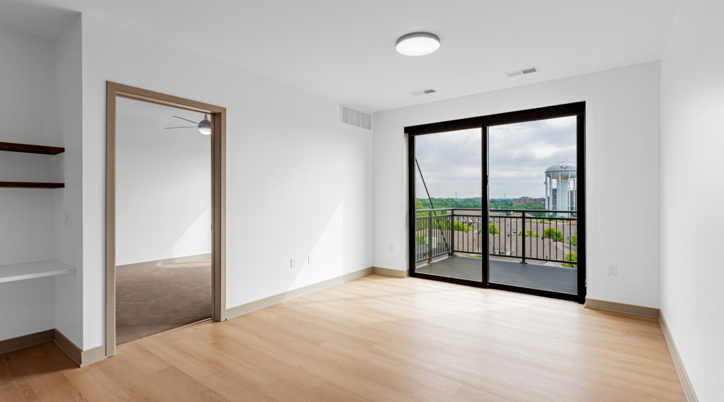 Living room with hardwood floors and sliding glass doors to balcony