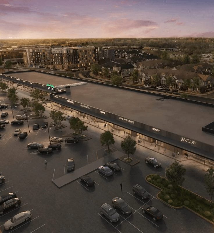 Aerial view of a Golden Valley shopping center with storefronts, parking, and nearby apartments