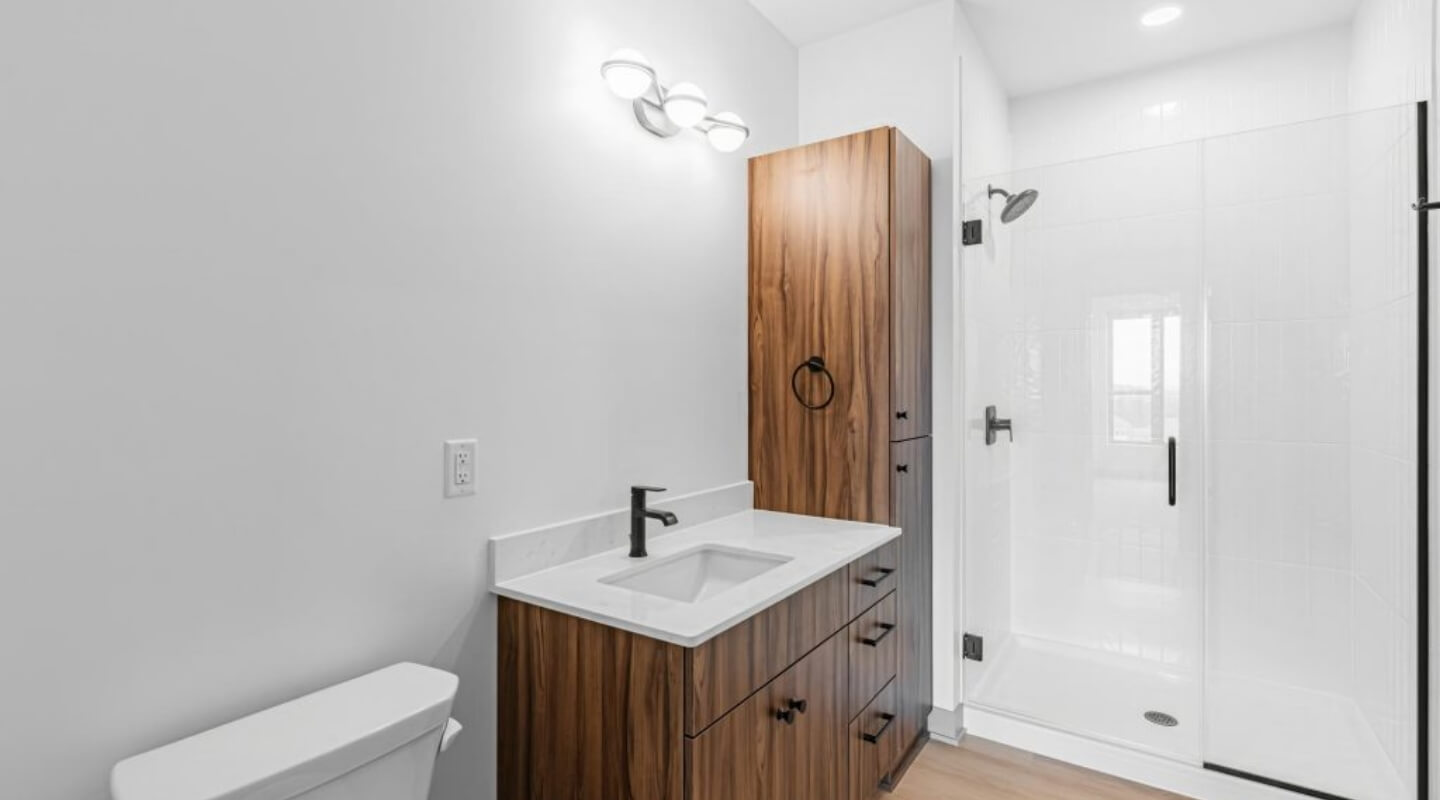 Contemporary bathroom at The Winn at Golden Valley with single vanity and glass shower