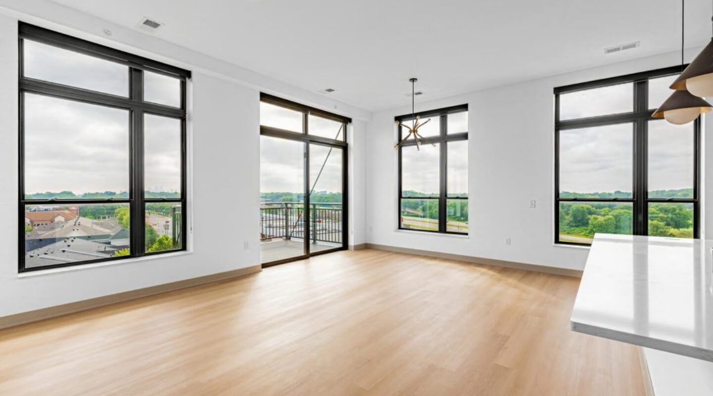 Living room at The Winn at Golden Valley with floor-to-ceiling windows and natural light
