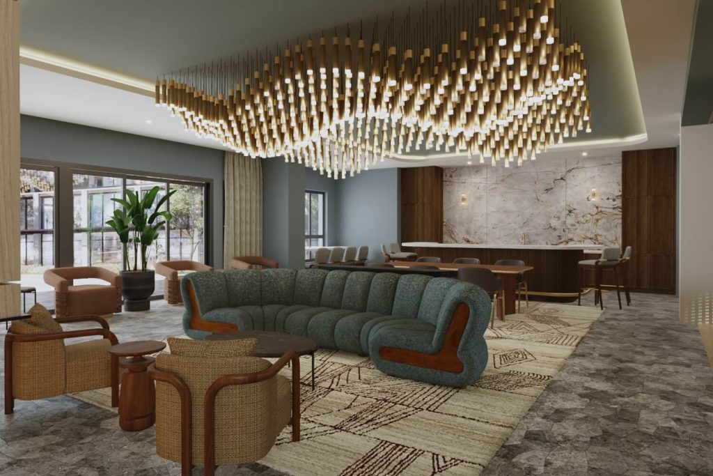 Alternate view of the club room at The Winn at Golden Valley showing a sectional sofa, bar, and seating area