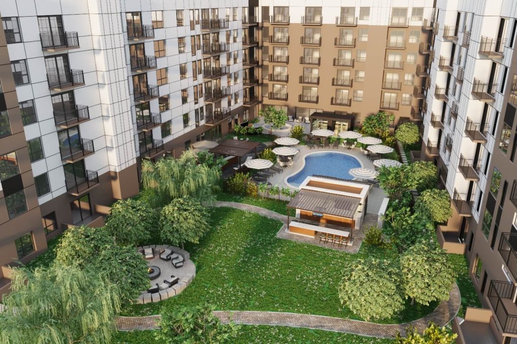 Courtyard at The Winn at Golden Valley featuring a pool, outdoor bar, lounge seating, and fire pit area