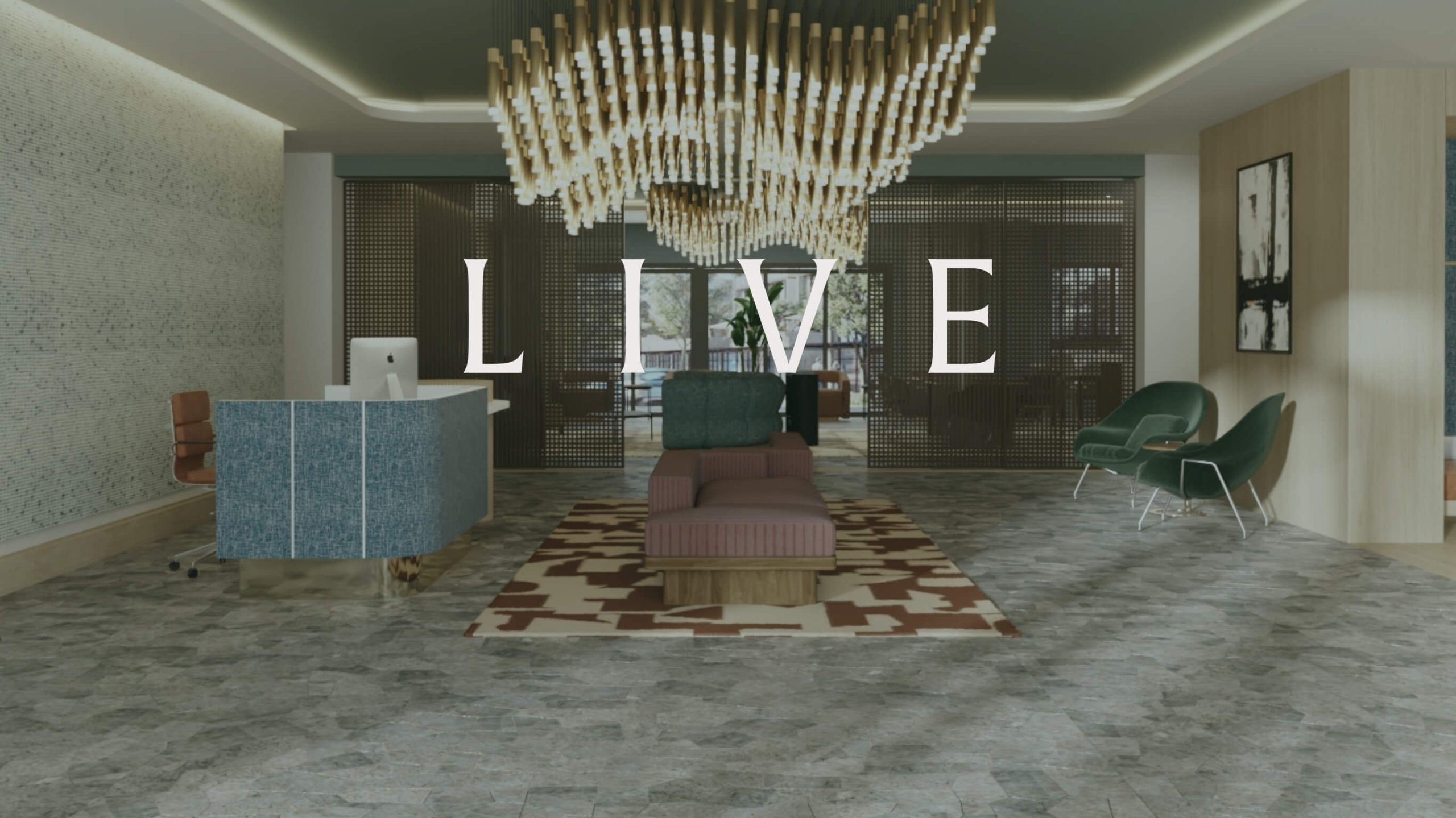 Apartment community lobby with seating area and chandelier featuring the word Live