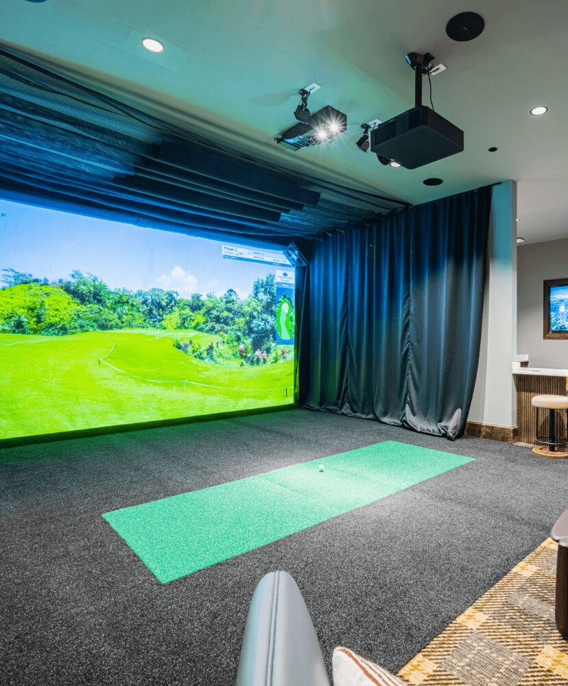 close shot of golf simulator machine within a game room.