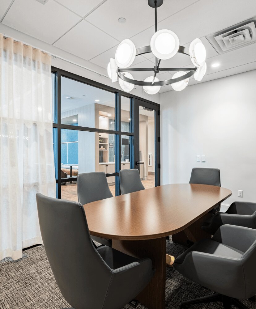 work from home suite with a table and chairs in a private room.